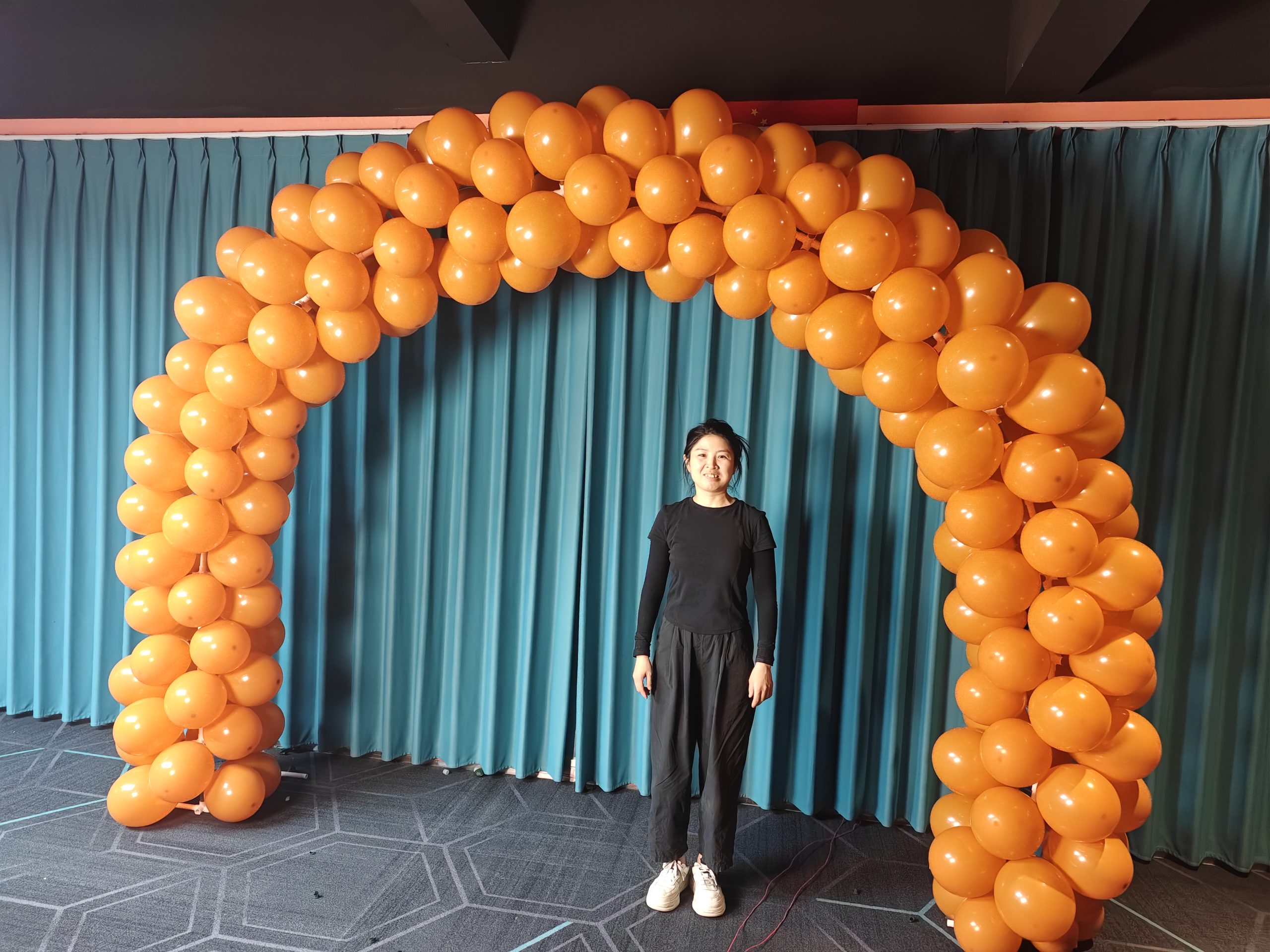 Grand opening inflatable balloon arch with person for scale